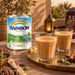 Rainbow evaporated milk alongside glasses of karak tea