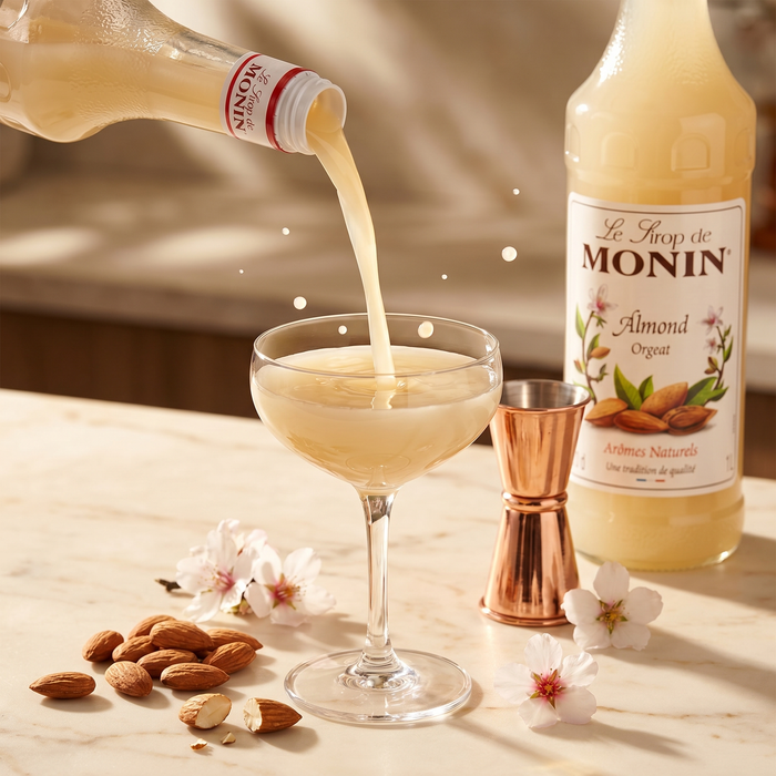 Monin Almond Orgeat Syrup 1L pour macro with almonds | Addtocart Dubai UAE