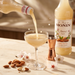 Monin Almond Orgeat Syrup 1L pour macro with almonds | Addtocart Dubai UAE